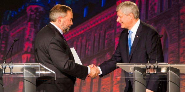 Thomas 'Tom' Mulcair, leader of the New Democratic Party, left, shakes hands with Conservative Leader Stephen Harper, Canada's prime minister, following the second leaders' debate in Calgary, Alberta, Canada, on Thursday, Sept. 17, 2015. The debate pits Harper and his Conservative Party's program of tax cuts and spending restraint against the Liberal Party's Justin Trudeau, who is pledging to raise taxes on the highest earners, and Mulcair, who advocates increasing levies on corporations. Photographer: Ben Nelms/Bloomberg via Getty Images