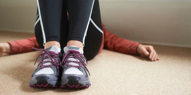 A woman relaxing in her bedroom after exercise