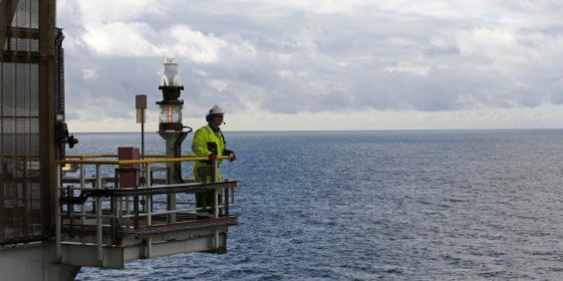 An employee looks out across the North Sea natural gas and oil field from the Troll A offshore gas platform, operated by Statoil ASA, near Bergen, Norway, on Thursday, Oct. 11, 2012. Statoil is holding talks with OAO Gazprom on how to make the Shtokman natural gas project in the Russian Arctic economically viable after the partners delayed the development over costs. Photographer: Chris Ratcliffe/Bloomberg via Getty Images