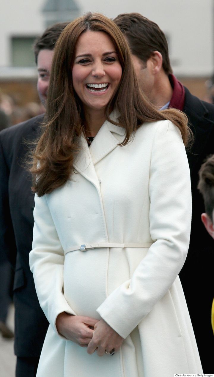 Kate Middleton's Belly Is In Full Bloom Under Chic White Coat