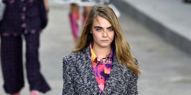 PARIS, FRANCE - SEPTEMBER 30: Model Cara Delevingne walks the runway during the Chanel show as part of the Paris Fashion Week Womenswear Spring/Summer 2015 on September 30, 2014 in Paris, France. (Photo by Pascal Le Segretain/Getty Images)