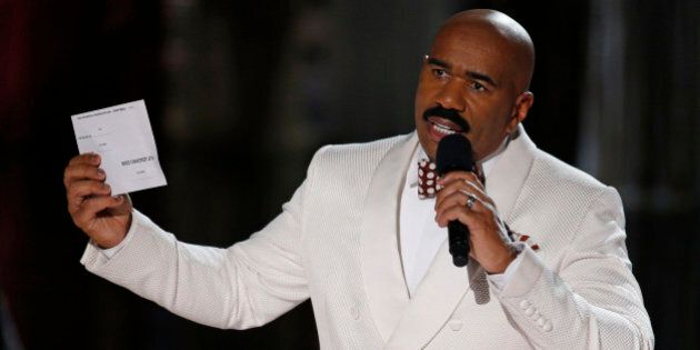 Steve Harvey holds up the card showing the winners after he incorrectly announced Miss Colombia Ariadna Gutierrez at the winner at the Miss Universe pageant Sunday, Dec. 20, 2015, in Las Vegas. According to the pageant, a misreading led the announcer to read Miss Colombia as the winner before they took it away and gave it to Miss Philippines Pia Alonzo Wurtzbach.(AP Photo/John Locher)
