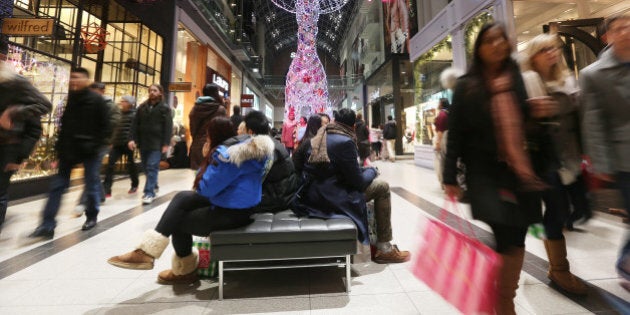 TORONTO, ON - DECEMBER 22: Shoppers rush about a busy Eaton Centre making purchases and enjoying the light throughout the busy mall on the last Saturday of shopping before Christmas in Toronto. December 22, 2012 STEVE RUSSELL/TORONTO STAR (Steve Russell/Toronto Star via Getty Images)