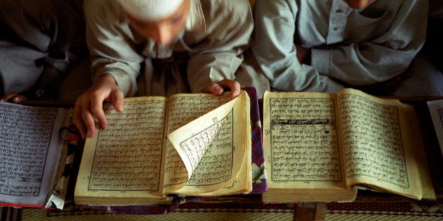 Unidentified young boys read the Koran at a Madrasa Qur'an school on September 24, 2001 in Rawalpindi 10 miles from Islamabad, Pakistan. The students, age 5-18 come from all over the country to live and study at the school. Many of these schools are recruiting grounds for the Taliban movement in Afghanistan, who are enforcing a strict law on the people of Afghanistan.