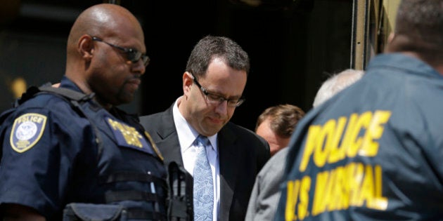 Former Subway pitchman Jared Fogle leaves the Federal Courthouse in Indianapolis, Wednesday, Aug. 19, 2015 following a hearing on child-pornography charges. Fogle agreed to plead guilty to allegations that he paid for sex acts with minors and received child pornography in a case that destroyed his career at the sandwich-shop chain and could send him to prison for more than a decade. (AP Photo/Michael Conroy)