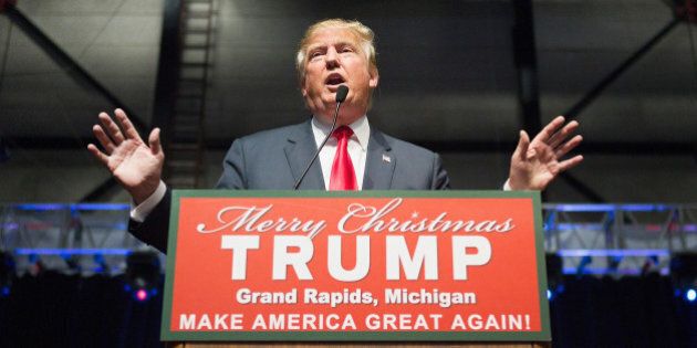 GRAND RAPIDS, MI - DECEMBER 21: Republican presidential candidate Donald Trump speaks to guests at a campaign event on December 21, 2015 in Grand Rapids, Michigan. The full-house event was repeatedly interrupted by protestors. Trump continues to lead the most polls in the race for the Republican nomination for president. (Photo by Scott Olson/Getty Images)