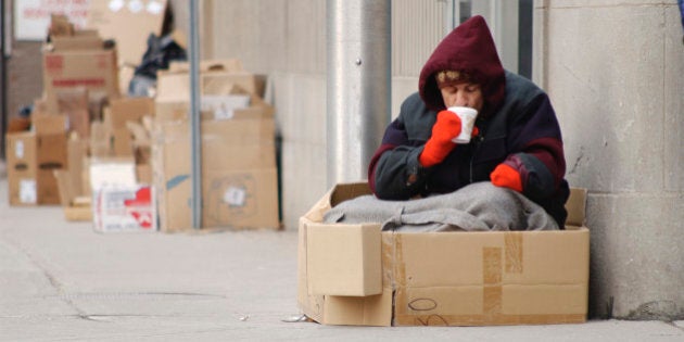 Homeless man drinking coffee