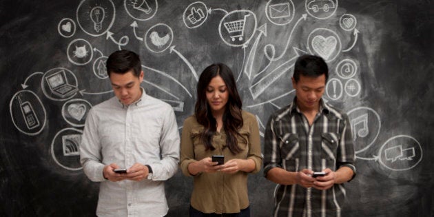 People on phones with social media icon chalkboard