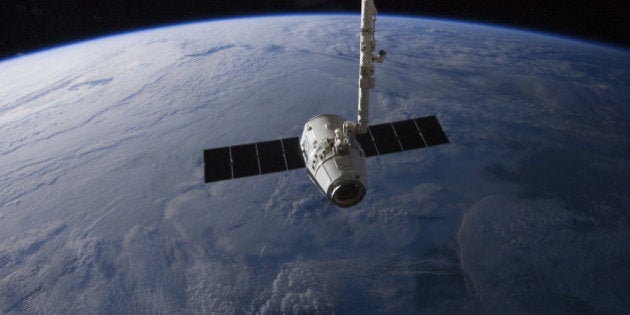 May 31, 2012 - The SpaceX Dragon cargo craft is suspended in the grasp of the Candarm2 robotic arm some 240 miles above Earth.