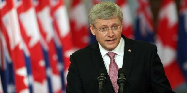 Canadian Prime Minister Stephen Harper addresses media alongside Australian Prime Minister Tony Abbott (not pictured) during a joint press conference in Parliament Hill in Ottawa, Canda on June 9, 2014. AFP PHOTO/ Cole BURSTON (Photo credit should read Cole Burston/AFP/Getty Images)