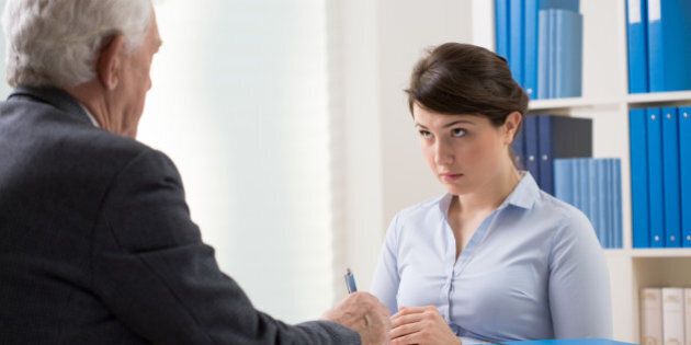 Young woman talking to a manager about new job