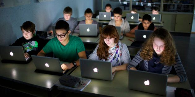 BERLIN, GERMANY - NOVEMBER 07: Pupils working at their lap-tops during a lesson at the Heinrich-Mann-School in the Neukoelln district of Berlin, Germany on November 07, 2012. (Photo by Thomas Trutschel/Photothek via Getty Images)