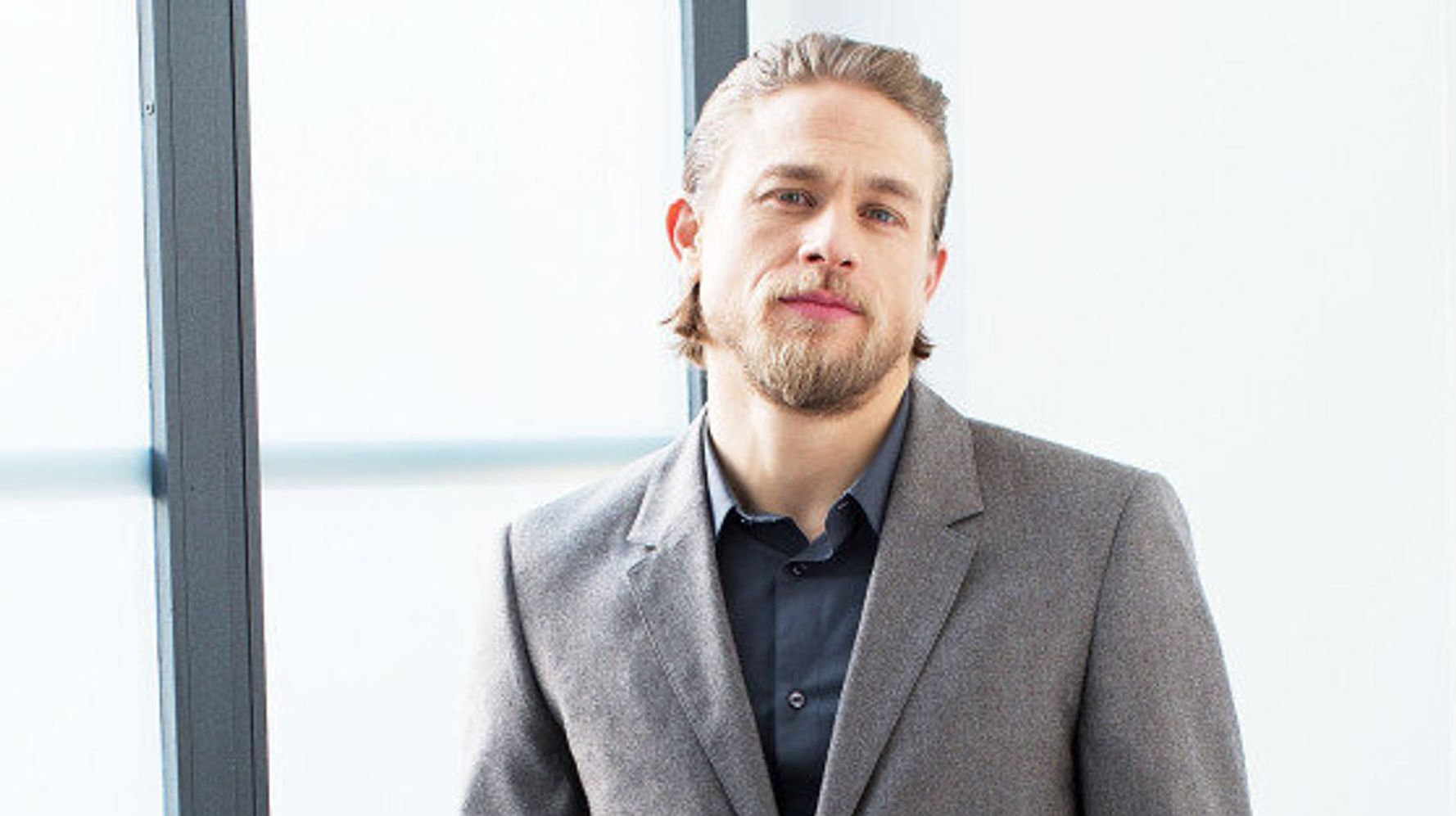 charlie hunnam wearing a ponytail