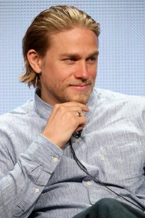 charlie hunnam wearing a ponytail