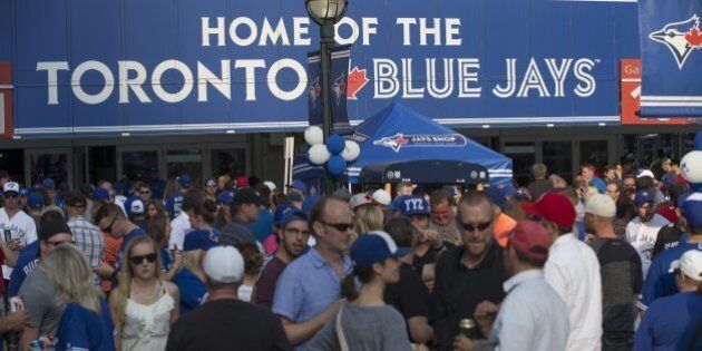 TORONTO, ONTARIO - AUGUST 14, 2015 - The fans are gathered outside gate 10-11 for the bands and outside activities. Toronto Blue Jays vs New York Yankees in Major League Baseball action at Rogers Centre on AUGUST 14, 2015. Rick Madonik/Toronto Star (Rick Madonik/Toronto Star via Getty Images)