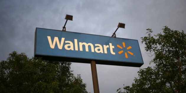 Wal-Mart Stores Inc. signage is displayed outside of a store in Louisville, Kentucky, U.S., on Friday, May 15, 2015. Wal-Mart Stores Inc. is expected to release first-quarter earnings results before the opening of U.S. financial markets on May 19. Photographer: Luke Sharrett/Bloomberg via Getty Images