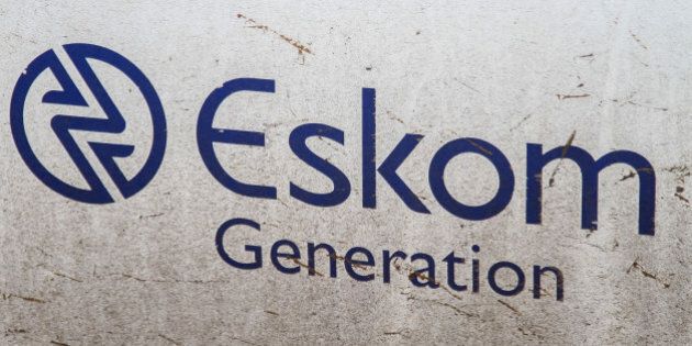 An Eskom Generation sign sits on display at the Grootvlei power station, operated by Eskom Holdings SOC Ltd., in Grootvlei, South Africa, on Monday, Nov. 3, 2014. Eskom said South Africa's power supply remains strained as it investigates what caused a silo storing coal to collapse, forcing the state-owned utility to cut electricity to customers. Photographer: Dean Hutton/Bloomberg via Getty Images