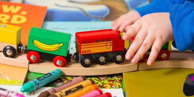 Generic stock photo shows a toddler playing with a selection of children's toys, including a train set and crayons. PRESS ASSOCIATION Photo. Picture date: Tuesday January 27, 2015. Photo credit should read: Dominic Lipinski/PA Wire