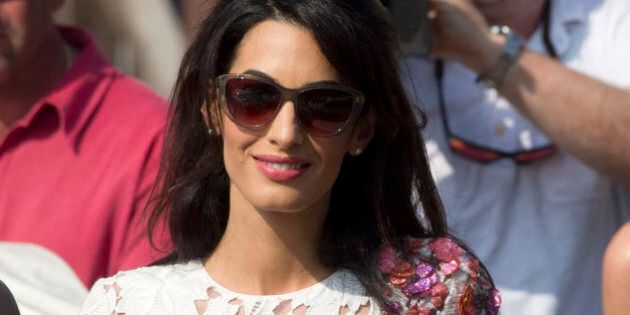 Amal Alamuddin leaves the Aman hotel in Venice, Italy, Sunday, Sept. 28, 2014. George Clooney and Amal married Saturday, Sept. 27, the actor's representative said, out of sight of pursuing paparazzi and adoring crowds.(AP Photo/Andrew Medichini)