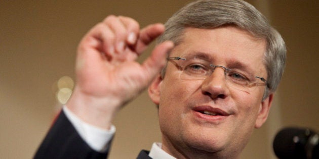 Canadian Prime Minister Stephen Harper speaks to the media at a press conference in Calgary, Alberta, May 3, 2011. Harper won re-election Monday at the head of a majority government, the first for his Conservative Party since 1988, television projections showed. In a ground-breaking election full of firsts, the left-leaning New Democratic Party (NDP) was on course to surge past the Liberals, which governed for most of the last century, and become Canada's official opposition. AFP/GEOFF ROBINS/STR (Photo credit should read GEOFF ROBINS/AFP/Getty Images)