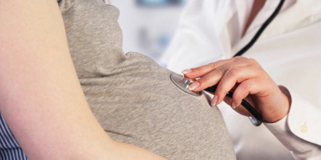 Doctor examining a pregnant woman