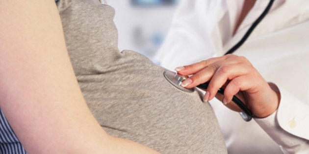 Doctor examining a pregnant woman