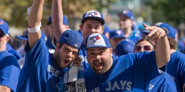 TORONTO, ON - OCTOBER 8: Fans line up outside Gate 4 and 6 waiting for the doors to the Roger's Centre to open. Toronto Blue Jays vs Texas Rangers in MLB playoff action at the Rogers Centre in Toronto. The Jays and Rangers are playing for the American League Division Championship. (Rick Madonik/Toronto Star via Getty Images)