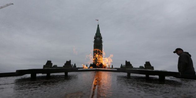 OTTAWA, ON - NOVEMBER 10:Tourists visit the Centennial Flame, lit in 1967 by Lester B. Pearson burns on Parliament Hill. Preparations are under way War Memorial on the eve of Remembrance Day. (Steve Russell/Toronto Star via Getty Images)