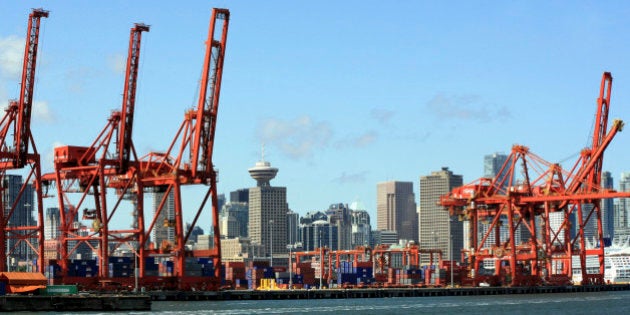 Cranes and containers at Vancouver Port & skyline