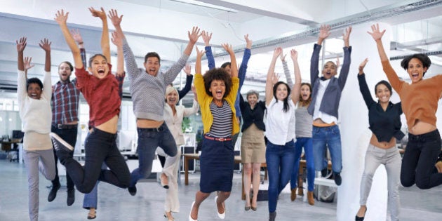 Shot of office staff jumping