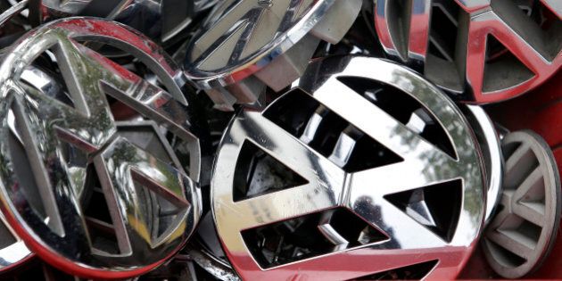 Volkswagen ornaments sit in a box in a scrap yard in Berlin, Germany, Wednesday, Sept. 23, 2015. The revelation that Volkswagen rigged diesel-powered cars to emit lower emissions during EPA tests is particularly stunning since Volkswagen has long projected a quirky brand image with an emphasis on being environmentally friendly _ an image that now appears in tatters. (AP Photo/Michael Sohn)