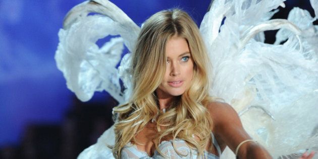Model Doutzen Kroes walks the runway during the 2013 Victoria's Secret Fashion Show at the 69th Regiment Armory on Wednesday, Nov. 13, 2013 in New York. (Photo by Evan Agostini/Invision/AP)