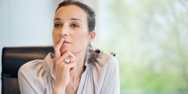 Close-up of a businesswoman thinking in an office