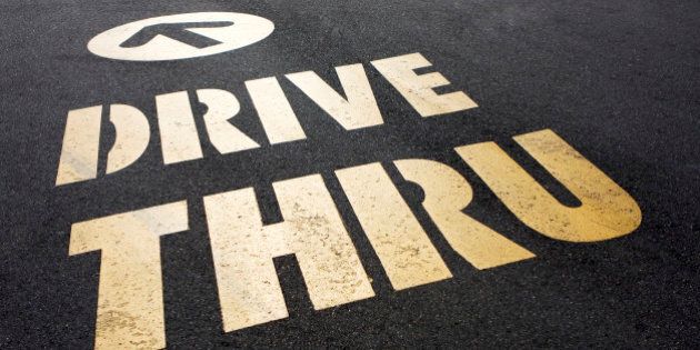 Drive Thru sign for fast food painted on asphalt