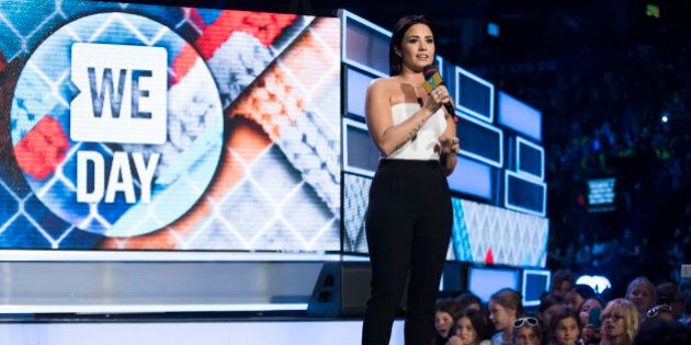 Demi Lovato speaks at We Day on Thursday, Oct. 1, 2015, in Toronto. (Photo by Arthur Mola/InvisionAP)