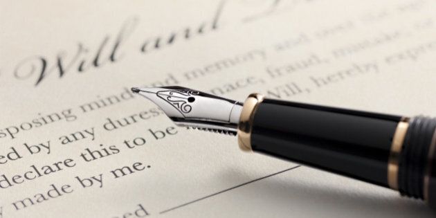 Last will and testament document with closeup on fountain pen with signature line. Critical focus on fountain pen.