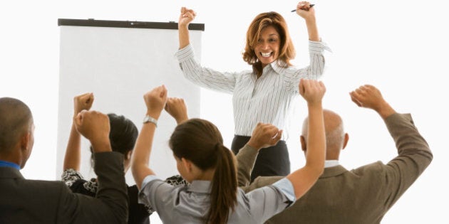 Excited businesswoman with chart giving presentation