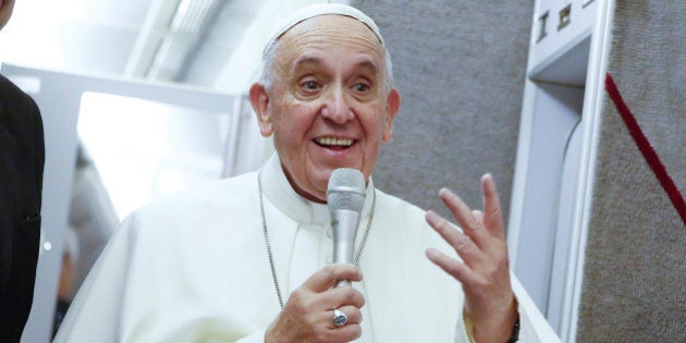 Pope Francis talks to journalists during a press conference he held while en route to Italy, Monday, Sept. 28, 2015. Pope Francis returned to the Vatican Monday at the end of a 10-day trip to Cuba and the United States. (Tony Gentile/Pool Photo via AP)