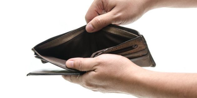 Empty wallet in male hands as symbol poverty and unemployment. Finance and poor economy. Isolated on white. Studio shot.
