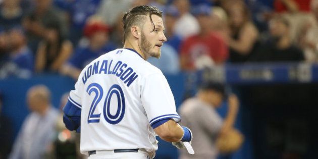 TORONTO, CANADA - AUGUST 14: Josh Donaldson #20 of the Toronto Blue Jays reacts after being called out on strikes to end the fifth inning during MLB game action against the New York Yankees on August 14, 2015 at Rogers Centre in Toronto, Ontario, Canada. (Photo by Tom Szczerbowski/Getty Images)