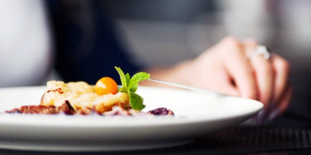 Female hand with a dinner