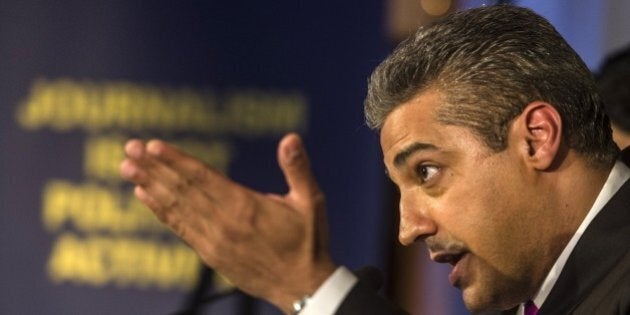 Egyptian-Canadian journalist Mohamed Fahmy, formerly with Al-Jazeera, attends a press conference in Cairo on May 11, 2015. Fahmy, who was sentenced last year to up to 10 years in prison, has sued his Qatari employer for $100 million, his lawyers said, claiming the satellite network was negligent and supported blacklisted Islamists. AFP PHOTO / KHALED DESOUKI (Photo credit should read KHALED DESOUKI/AFP/Getty Images)