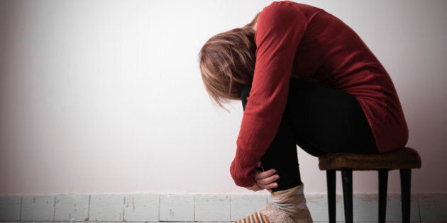 A woman sitting alone.