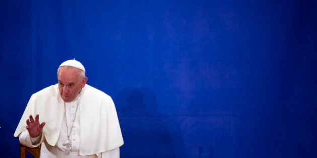 NEW YORK, NY - SEPTEMBER 25: Pope Francis waves to people inside of Our Lady Queen of Angels on September 25, 2015 in the neighborhood of East Harlem in New York City. Pope Francis is on a six-day trip to the USA, which includes stops in Washington DC, New York and Philadelphia, after a three-day stay in Cuba. (Photo by John Taggart-Pool/Getty Images)