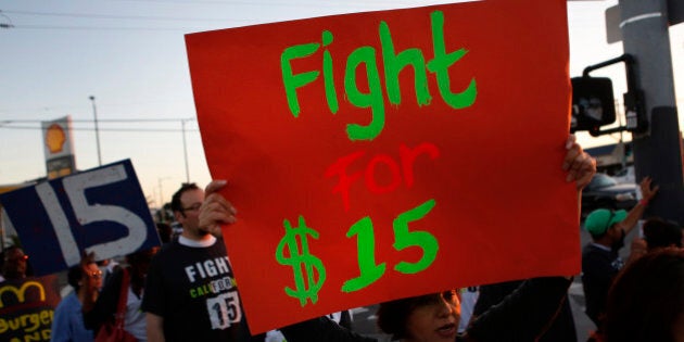 Fast-food workers and supporters organized by the Service Employees International Union (SEIU) protest outside of a Burger King Worldwide Inc. restaurant in Los Angeles, California, U.S., on Thursday, Aug. 29, 2013. Fast-food workers in 50 U.S. cities plan to walk off the job today, ratcheting up pressure on the industry to raise wages and demanding the right to wages of $15 an hour, more than double the federal minimum of $7.25. Photographer: Patrick T. Fallon/Bloomberg via Getty Images