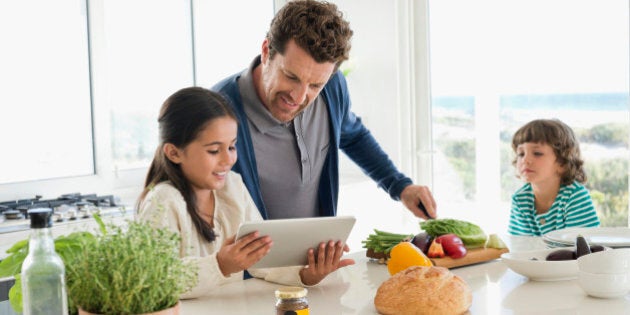 Man preparing food for his children