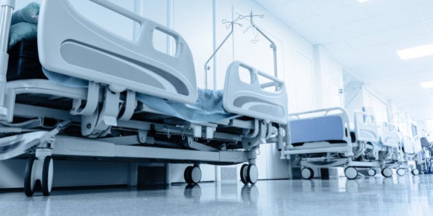 long corridor in hospital with surgical beds. tinted picture