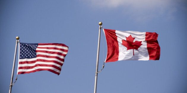 American and Canadian flag flying side by side.
