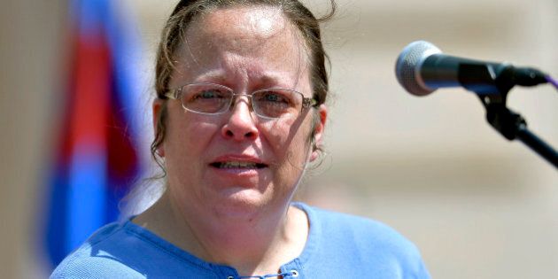 Rowan County Kentucky Clerk Kim Davis speaks to a gathering of supporters during a rally on the steps of the Kentucky State Capitol in Frankfort Ky., Saturday, Aug. 22, 2015. Davis spoke at the rally organized by The Family Foundation of Kentucky on Saturday afternoon. The crowd of a few thousand included churchgoers from around the state. Davis has been sued by The American Civil Liberties Union for denying marriage licenses to gay couples. She says her Christian faith prohibits her from signing licenses for same-sex couples. (AP Photo/Timothy D. Easley)