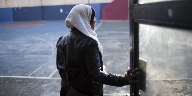 NEW YORK - DECEMBER 15: A senior high school girl at the Al Noor School walks through the playground during a free period December 15, 2010 in the Brooklyn borough of New York. The Al Noor School is a private all-Muslim K-12 school with over 600 students. (Photo by Robert Nickelsberg/Getty Images)